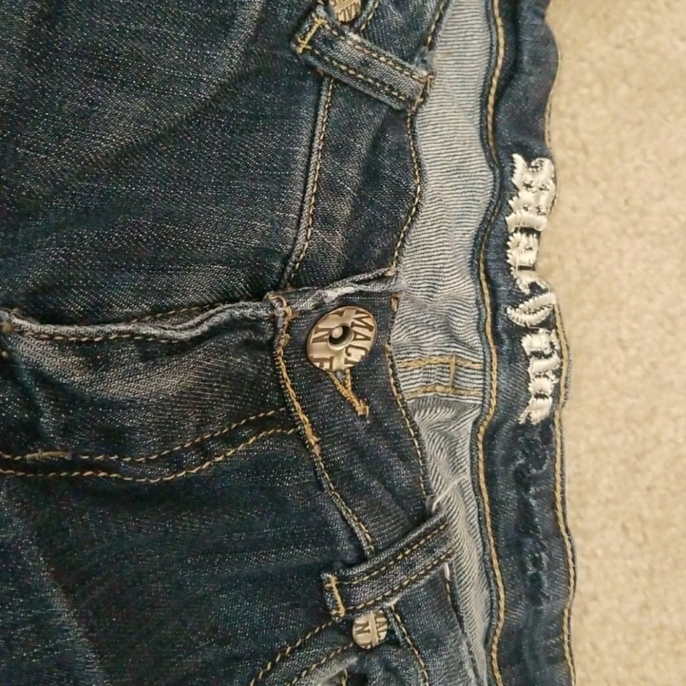 Extreme distressed dark jeans